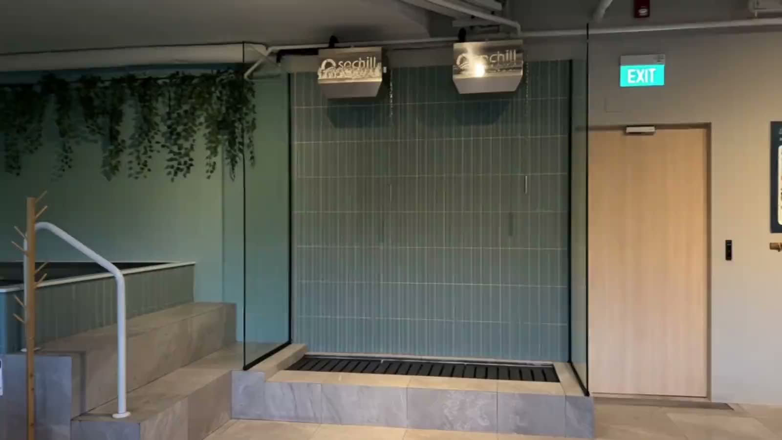 Floor-to-ceiling windows looking out onto greenery at SOCHILL Bath Club